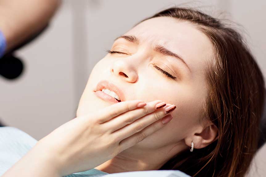 Young woman patient waiting treatment in stomatology clinic